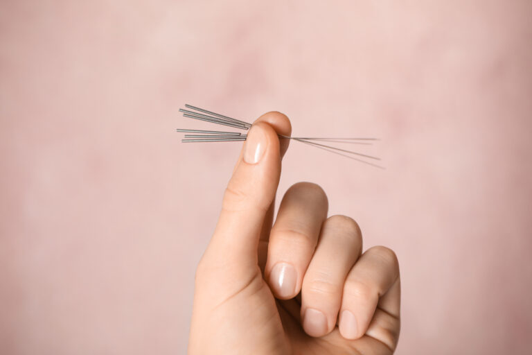 Woman Holding Needles For Acupuncture On Pink Background