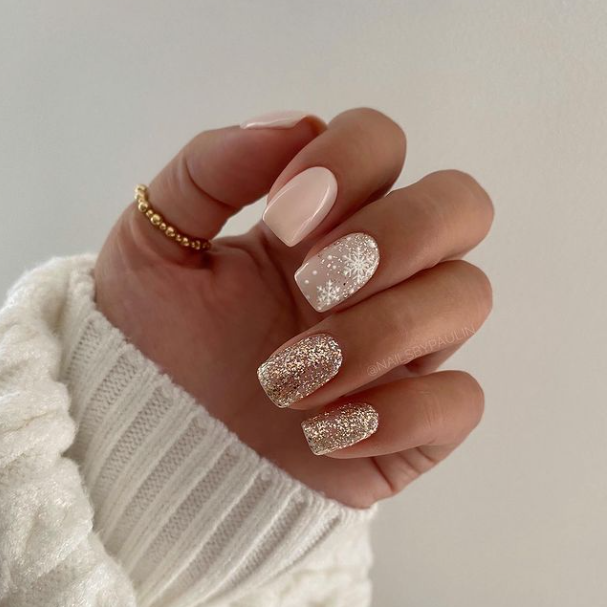 Gold snowflake nail art
