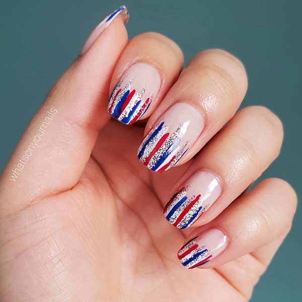 red and blue striped nails