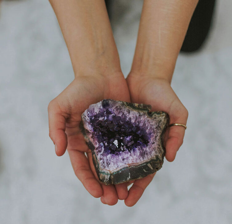 woman holding amethyst